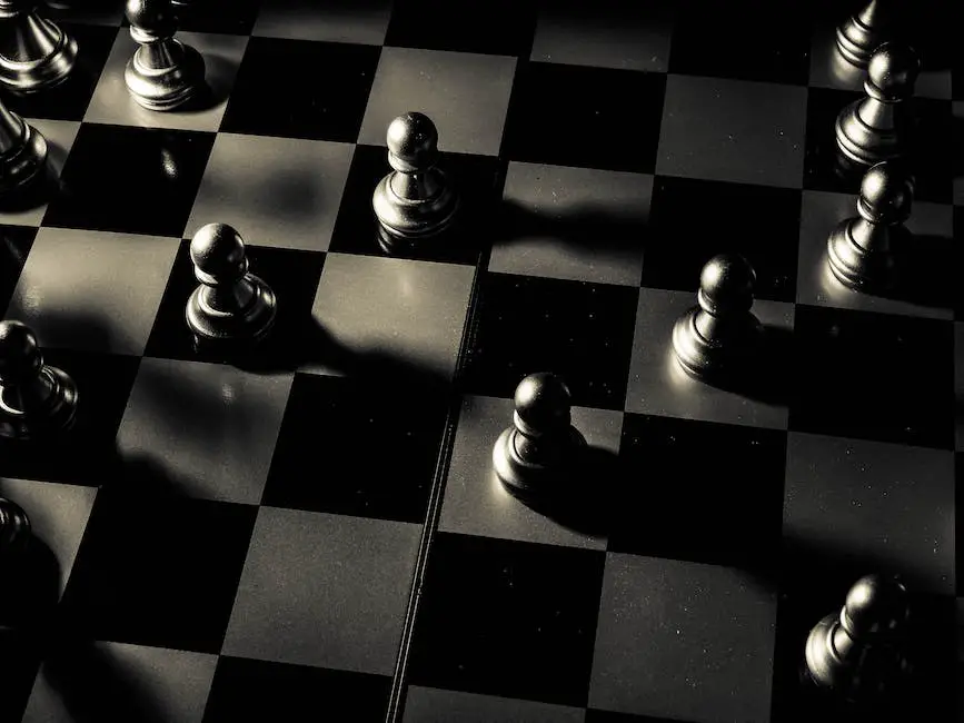 A black and white image of an old chess board with pieces on it, representing the history of chess.