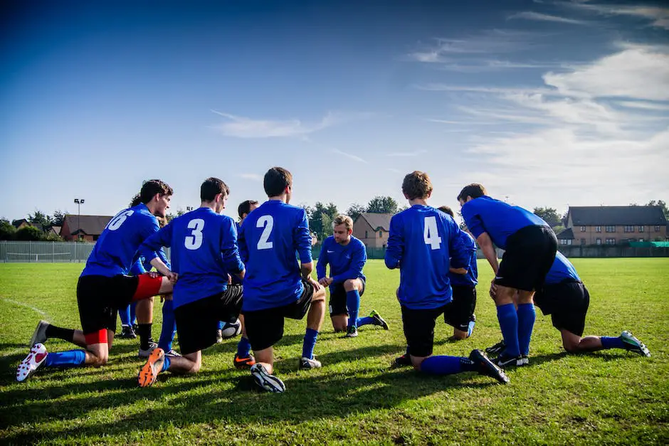 A group of football players strategizing on the field.