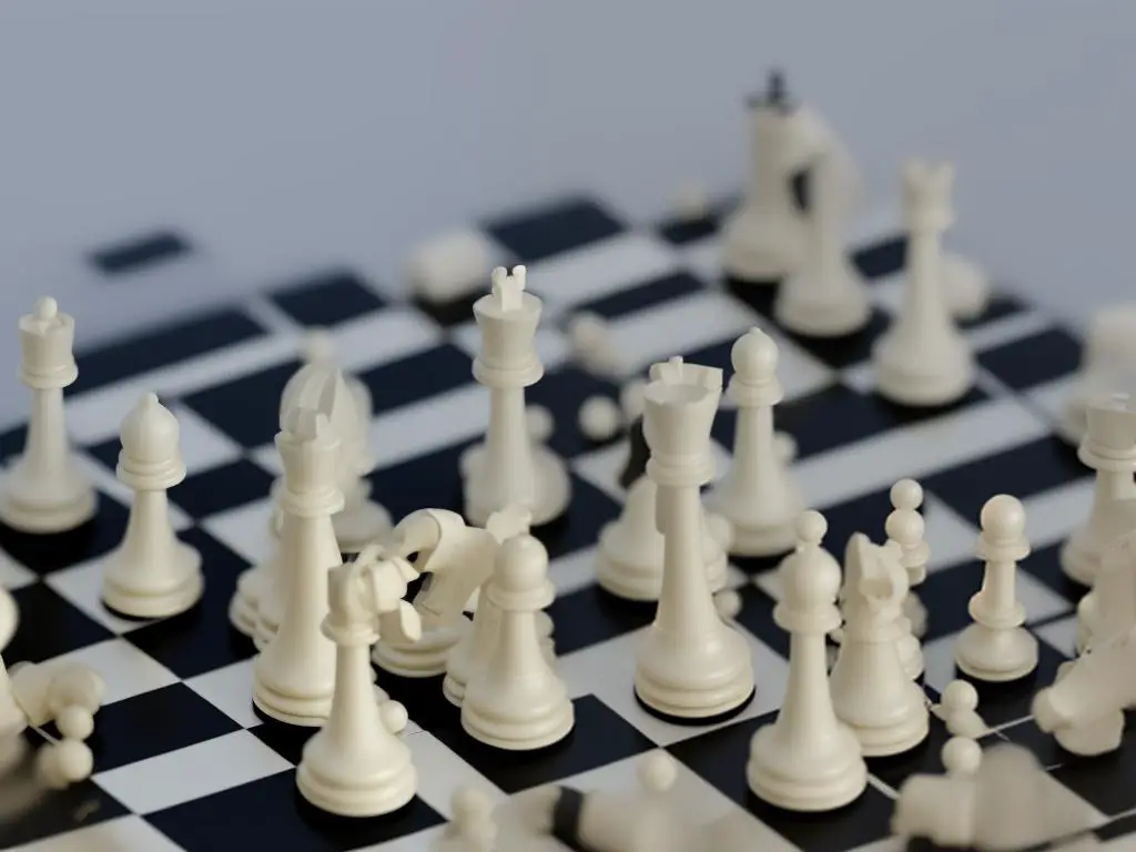 Chess pieces on a computer screen with blurred background