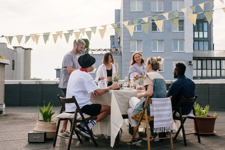 Picture of friends gathered around a variety of comfortable seating options and a canopy at a tailgate party